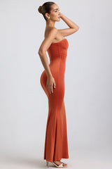 Kehlani-Slinky Jersey Hardware Detail Strapless Maxi Dress in Burnt Orange