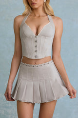 Laika-Low-Rise Pleated Mini Skirt in Ecru