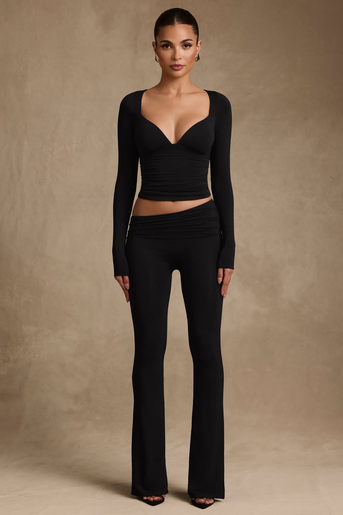 Kalei-Modal Asymmetric-Waist Flared Trousers in Black