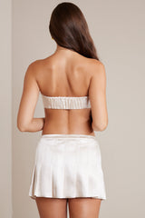 Cove-Satin Low-Rise Pleated Mini Skirt in Ivory
