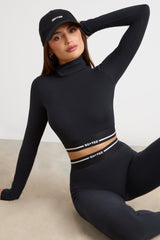 Stretch Cotton Jersey Backless Turtleneck Long-Sleeve Crop Top in Black