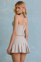 Laika-Low-Rise Pleated Mini Skirt in Ecru