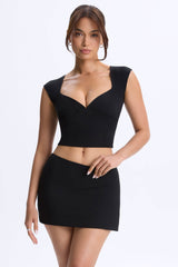 Lyra-Mid-Rise Micro Mini Skirt in Black